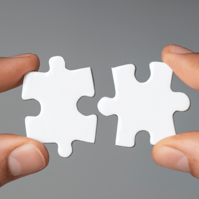 Illustration of two puzzle pieces fitting together, symbolizing KC Global Network Inc's seamless logistic solutions